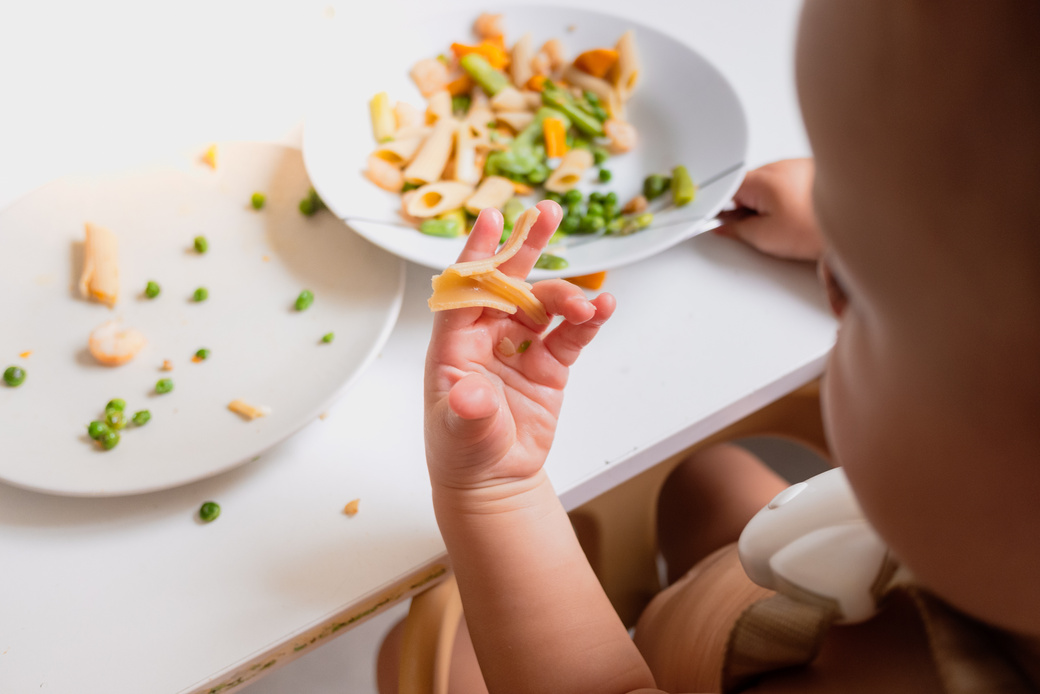 One-Year-Old Baby Eats the Food from His Plate Directly with His