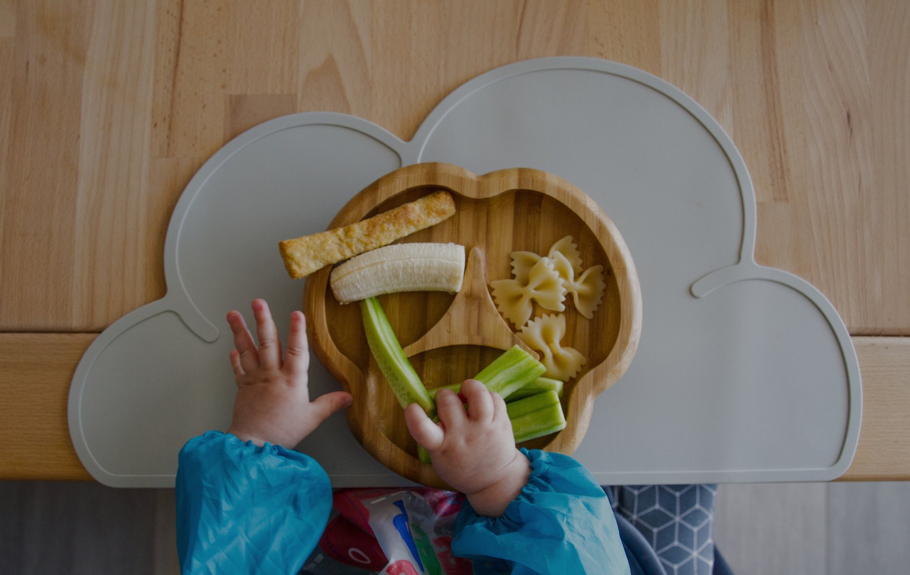 Baby nutrition BLW (baby-led weaning) with baby hands grabbing for food