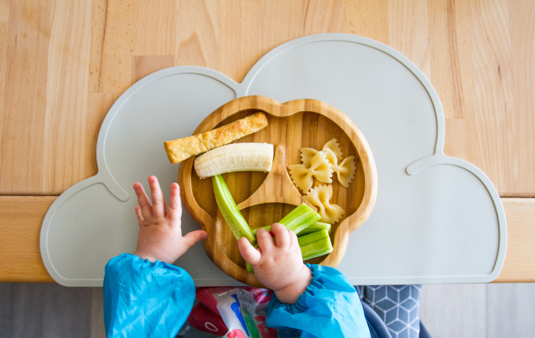 Baby nutrition BLW (baby-led weaning) with baby hands grabbing for food